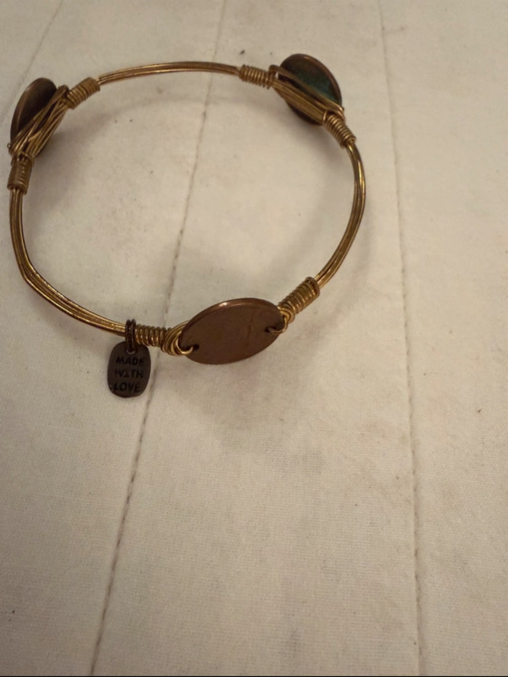 Bourbon and Bowties Gold Tone Wire Bangle with Oval Discs